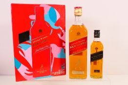 A Johnnie Walker gift set comprising a 700ml bottle of Red Label and a 200ml bottle of Black Label,