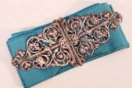 A Victorian silver nurse's buckle, cast in openwork with birds head,