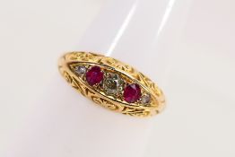 A yellow metal, stamped 18ct, stone set ring with scrollwork surround, size M+½, approximately 2.