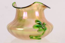 A Bohemian Art Nouveau period iridescent glass vase with applied floral decoration and shaped rim