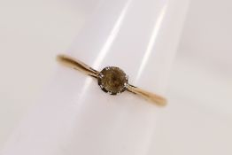 A yellow metal, stamped 18ct solitaire ring, size L, approximately 1.2 grams.
