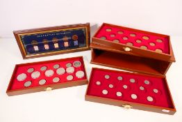 A three drawer coin display chest containing a quantity of coins and a 20th Century Monarchs framed