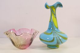 A glass vase with shaped rim and controlled bubble decoration in two-tone pink and clear glass by