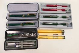 Six Parker pens / sets, mostly advertising examples to include Carlsberg,