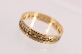 A yellow metal stone set full eternity ring, size L+½,