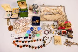 A quantity of vintage and later costume jewellery comprising pearl bead necklaces,