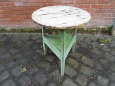 A George III oak cricket table with circular top and triangular undertier,