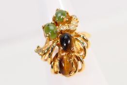 A yellow metal (stamped 18K) stone set ring, size L, approximately 3.8 grams.