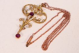 A yellow metal pendant set with amethyst and split pearl,