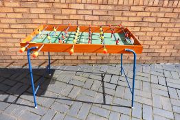 A Vintage folding Football Table with detachable nets and football.