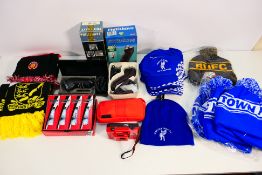A quantity of football scarves and hats, a box of Srixon Distance golf balls, a camera and other.