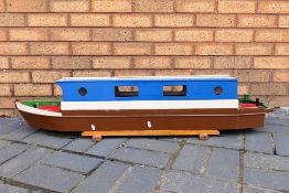 A scratch built wooden canal barge,
