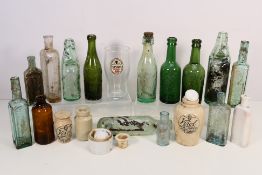 A collection of vintage glass bottles to include Codd-neck, medicinal,