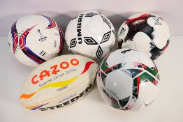 Four Size 5 replica footballs comprising