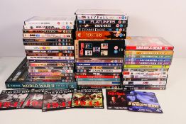 A collection of DVDs to include feature films, comedy series, stand up, military related,