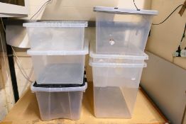 Six various sized plastic storage boxes.