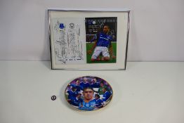An Everton Football Club match programme bearing multiple signatures in silver ink, framed,