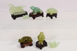 A collection of Chinese jade or similar hardstone animal figures to include horse, coiled snake,