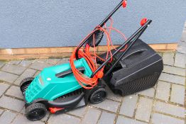 A Bosch Rotak 320 ER electric lawn mower.