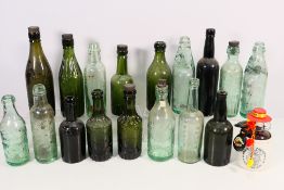 A collection of vintage glass bottles to include John Lyon & Co, Ind Coope & Co,