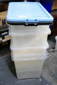 Five plastic storage boxes, various sizes.