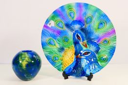 A glass bowl with colourful peacock decoration, approximately 35.