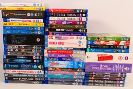 A collection of Blu-ray and DVD discs comprising feature films, box sets, animation and similar.