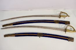Two Indian Talwar style swords with 75 cm (l) blades, brass hilt and guard, 88 cm (l) overall. [2]..