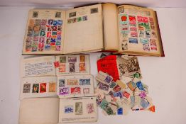 Two vintage stamp albums containing a quantity of GB and foreign stamps and a small amount of loose
