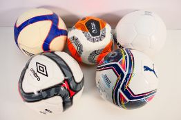 Four Size 5 replica footballs and one Si