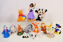 A collection of Disney themed figures / groups comprising Winnie The Pooh, Beauty And The Beast,