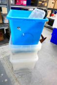 Six plastic storage boxes, various sizes.