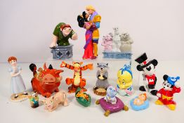 A collection of Disney themed figures / groups comprising Winnie The Pooh, Mickey Mouse,