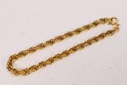 A yellow metal, stamped 375, rope twist bracelet, 19 cm (l), approximately 8 grams.