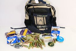 A rucksack (day sack) containing 54 x 12 g airsoft and air pistol CO2 capsules, 1 tin of 0.