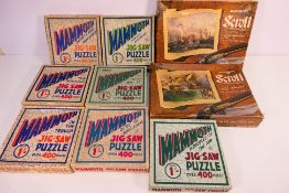 Nine boxed vintage jigsaw puzzles comprising two Waddingtons Scroll,
