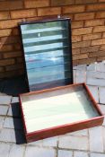 Two glass display cases with glass shelves, largest approximately 63 cm x 43 cm x 13 cm. [2].
