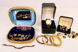 A collection of costume jewellery including a silver hinged bangle,