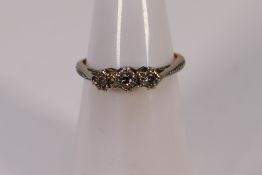 A 9ct gold diamond trilogy ring with ill