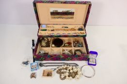 A jewellery box containing a quantity of