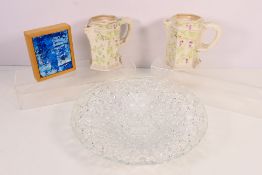 A pair of Belleek hexagonal section jugs with moulded decoration of fruiting vine,