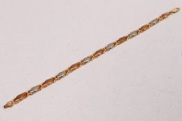 A 9ct gold two-tone bracelet, 19 cm (l), approximately 4.3 grams.