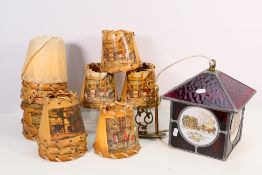 A glass lantern decorated with coaching scenes and a quantity of similarly decorated light shades.