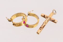 A 9ct yellow gold crucifix pendant, 2.8 cm (l) and approximately 2.