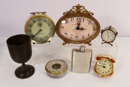 A small collection of clocks and baromet