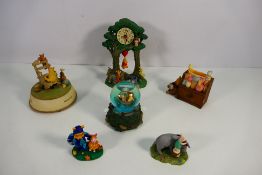 Disney - A collection of Winnie The Pooh related items to include a mantel clock, snow globe,