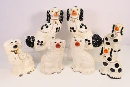 A collection of Staffordshire dog type figures, various makers to include Beswick,