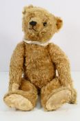 Steiff - A large 20 inch Steiff blonde mohair disc jointed bear with shoe button eyes and the