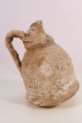 A Roman or Hellenistic stoneware wine jug,