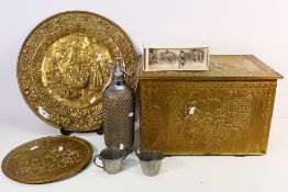 Brassware to include a brass clad coal box and charger, a set of four Safari Napkin Rings,